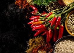 Beautiful Tasty Appetizing Ingredients Spices Grocery for Cooking Healthy Kitchen. Dark Black Background Toning Copy Space
