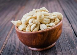 Cashew on wooden background - film effect style pictures