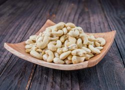 Cashew on wooden background - film effect style pictures