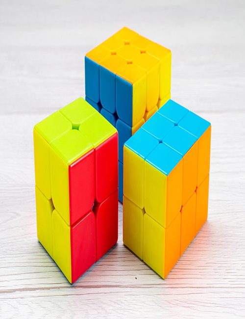 front view colorful toy constructions designed shaped colored on front view colorful toy constructions designed shaped colored on the light desk toy plastic color photo